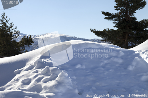 Image of Snowdrifts in mountain after snowfall at sun winter day