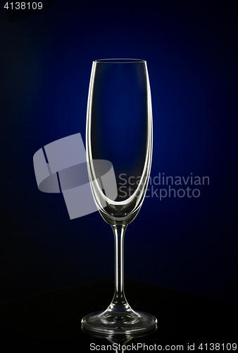 Image of Empty wine glass on dark red