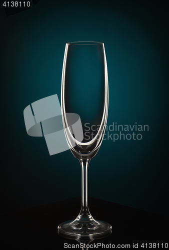 Image of Empty wine glass on dark red