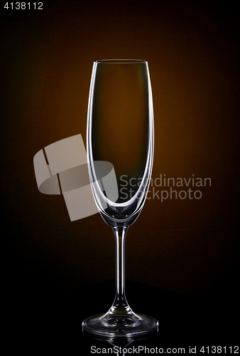 Image of Empty wine glass on dark red