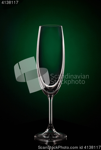 Image of Empty wine glass on dark red