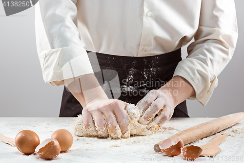 Image of Hands kneading a dough