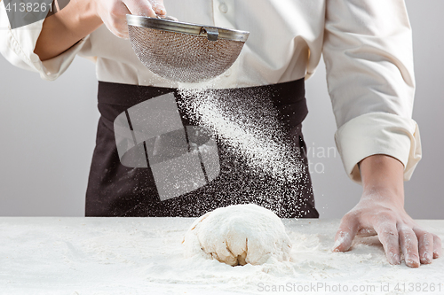 Image of Hands kneading a dough