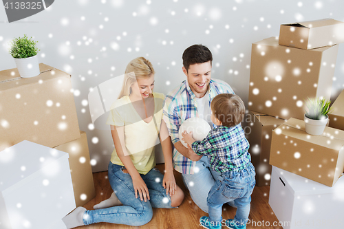 Image of happy family moving to new home and playing ball