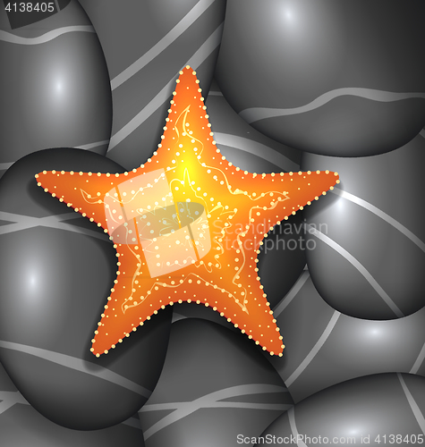 Image of Orange starfish among sea pebble stones