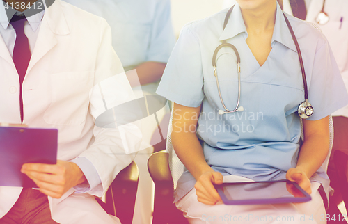 Image of close up of happy doctors at seminar or hospital