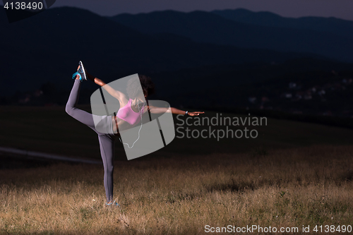 Image of black woman doing yoga  in the nature