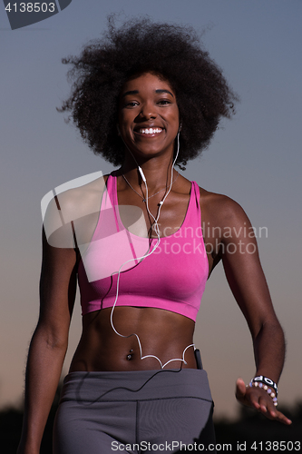 Image of black woman is doing stretching exercise relaxing and warm up