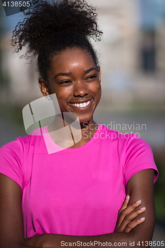 Image of Portrait of sporty young african american woman running outdoors