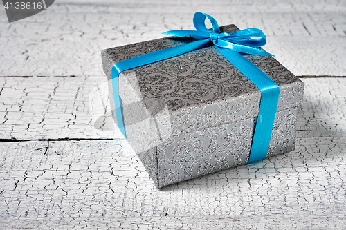 Image of Gift box with blue ribbon