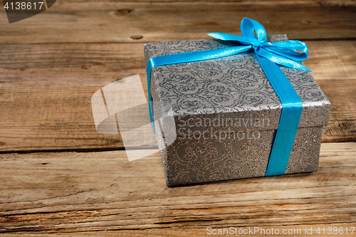 Image of Gift box with blue ribbon