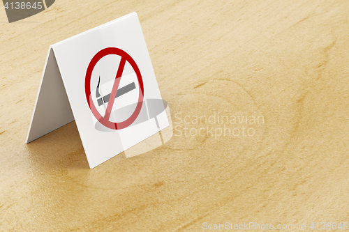 Image of No smoking sign on table