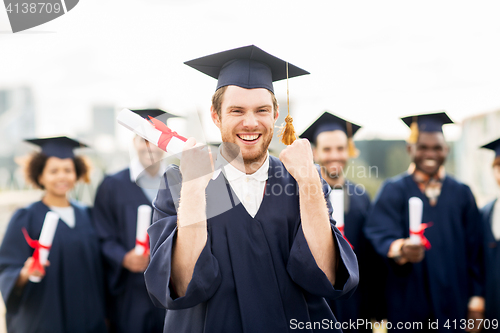 Image of happy student with diploma celebrating graduation