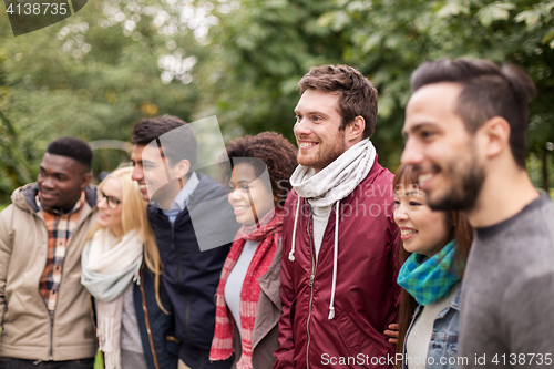 Image of group of happy international friends outdoors