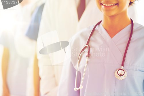 Image of close up of happy doctor or nurse with stethoscope