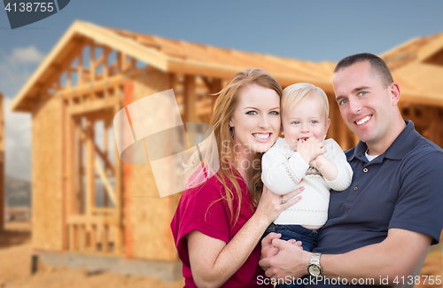 Image of Young Military Family Outside Their New Home Framing