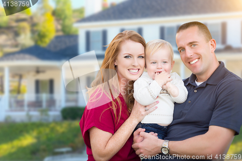 Image of Young Military Family in Front of Their House