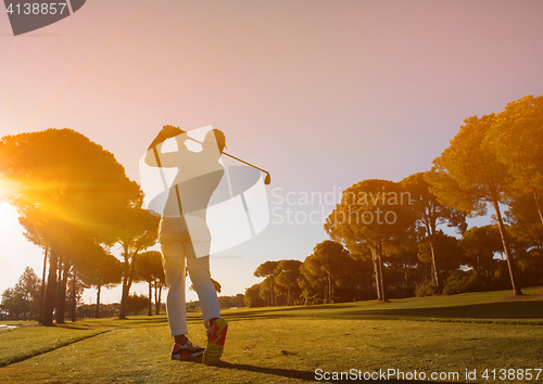 Image of golf player hitting shot with club