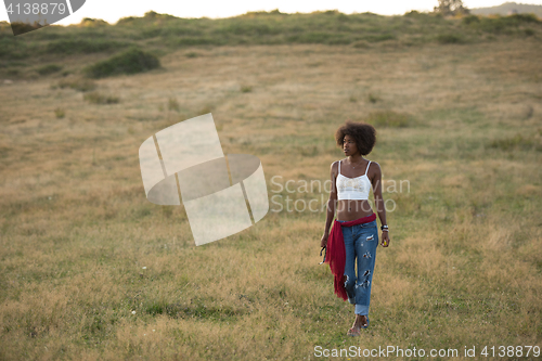 Image of young black woman in nature