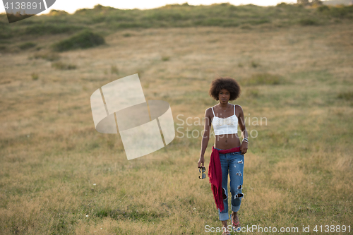 Image of young black woman in nature