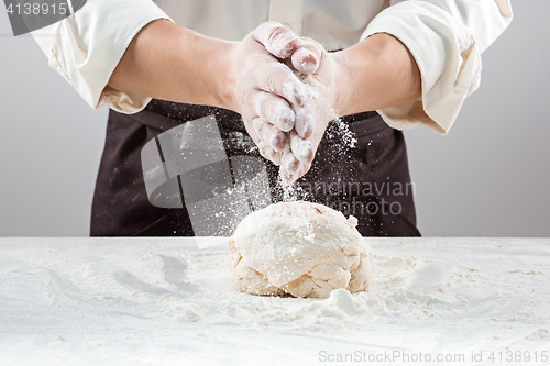 Image of Hands kneading a dough