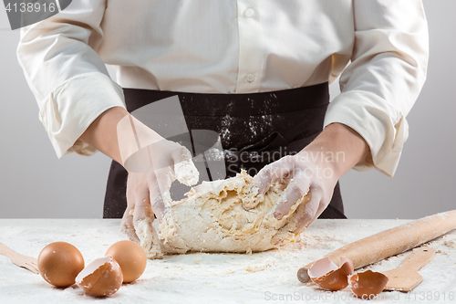 Image of Hands kneading a dough