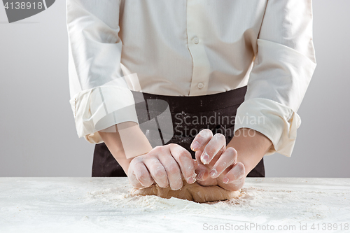 Image of Hands kneading a dough