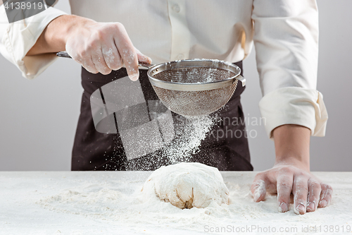 Image of Hands kneading a dough