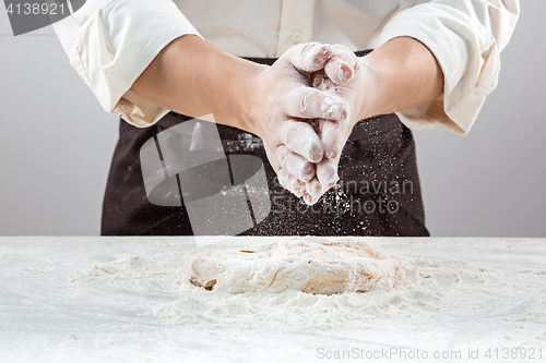 Image of Hands kneading a dough