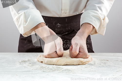 Image of Hands kneading a dough