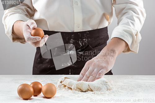 Image of Hands kneading a dough