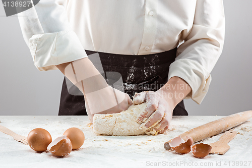 Image of Hands kneading a dough