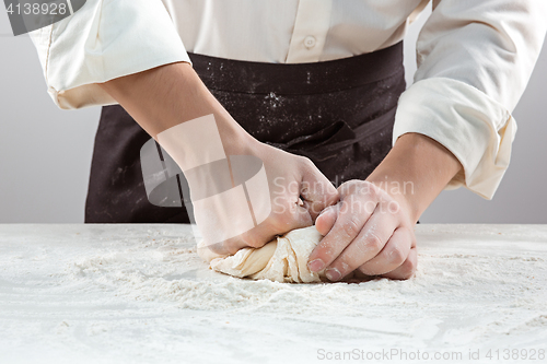 Image of Hands kneading a dough