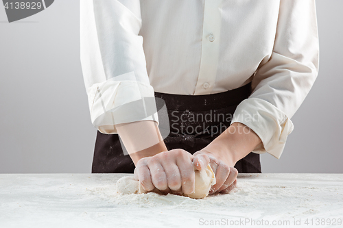 Image of Hands kneading a dough