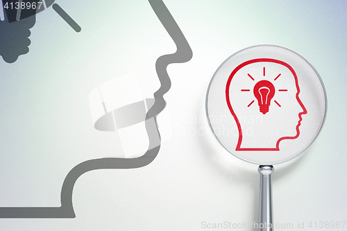 Image of Data concept:  Head With Lightbulb with optical glass on digital background