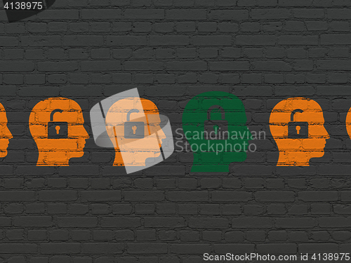 Image of Business concept: head with padlock icon on wall background