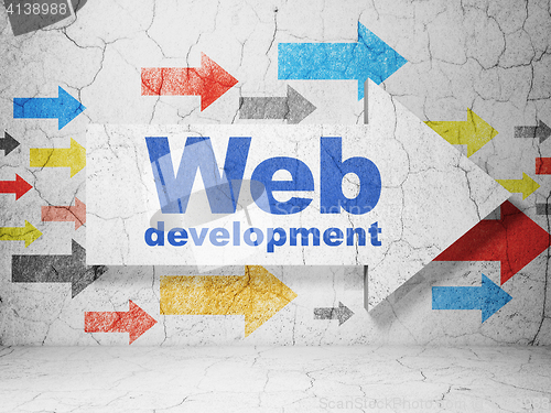 Image of Web design concept: arrow with Web Development on grunge wall background