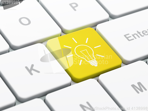 Image of Business concept: Light Bulb on computer keyboard background