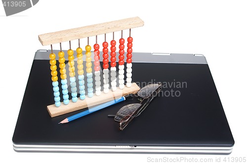 Image of Laptop and abacus