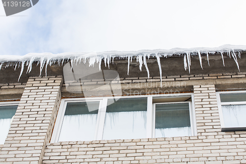 Image of icicles on building or living house facade