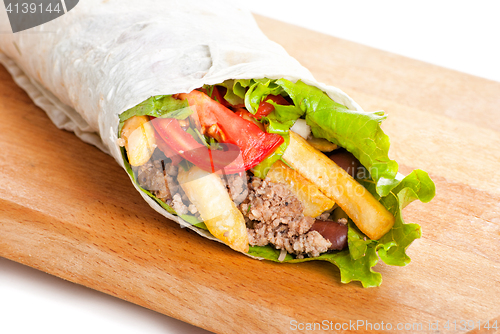 Image of beef burrito with peppers, fried potato and tomato