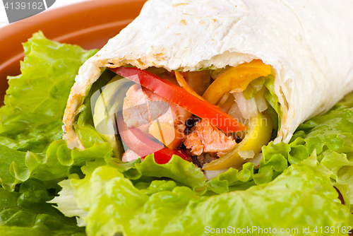 Image of burrito with salmon, peppers and tomato