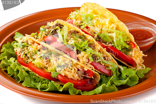 Image of beef tacos with salad and tomatoes salsa