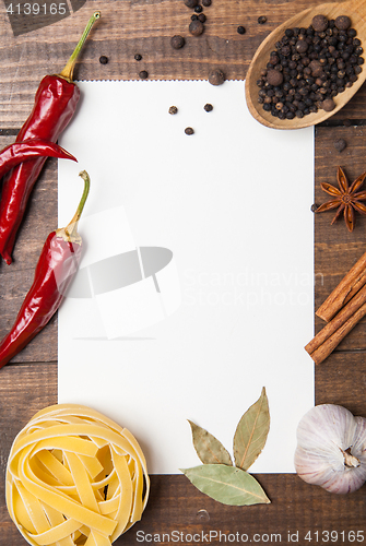 Image of blank paper with pasta, pepper and spices