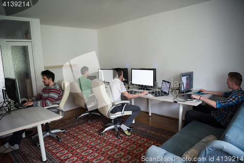 Image of a group of graphic designers at work