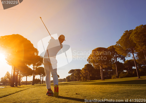 Image of golf player hitting shot with club