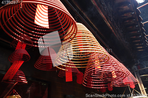 Image of Coil shape incense hang in the Temple 