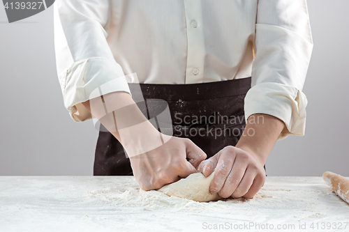 Image of Hands kneading a dough