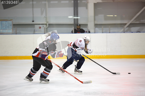 Image of Moscow, Russia - January, 07, 2017: Female amateur hockey leage LHL-77. Game between female hockey team \"Grad\" and female hockey team \"Atlant\".