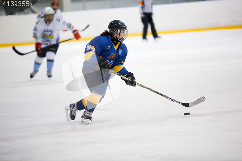 Image of Moscow, Russia - January, 07, 2017: Female amateur hockey leage LHL-77. Game between female hockey team \"Grad\" and female hockey team \"Atlant\".